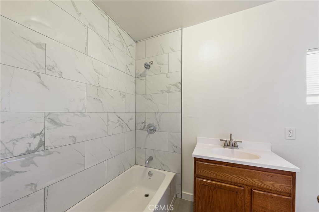 15323 Paramount Boulevard Paramount, CA 90723 - Photo 27 of 72 a white bath tub sitting next to a white sink