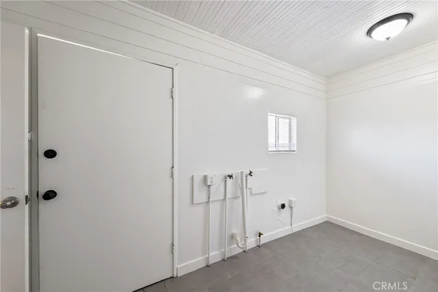 a view of a patio with table and chairs with wooden floor and fence