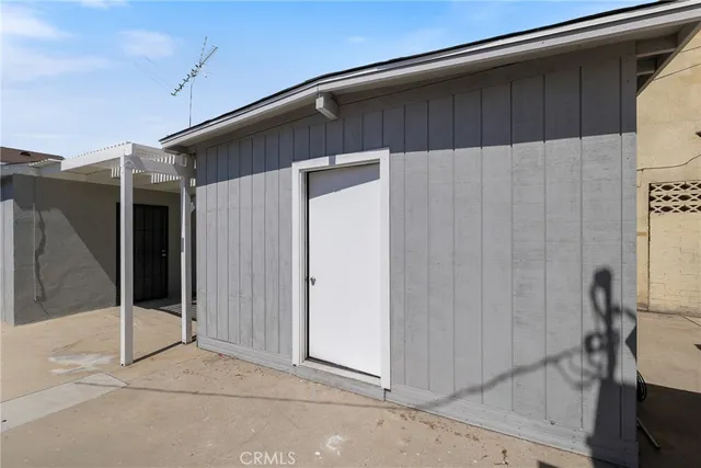 a front view of a house with outdoor seating