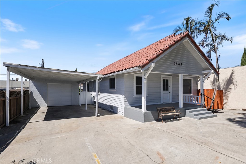 15323 Paramount Boulevard Paramount, CA 90723 - Photo 7 of 72 a view of a house with a patio