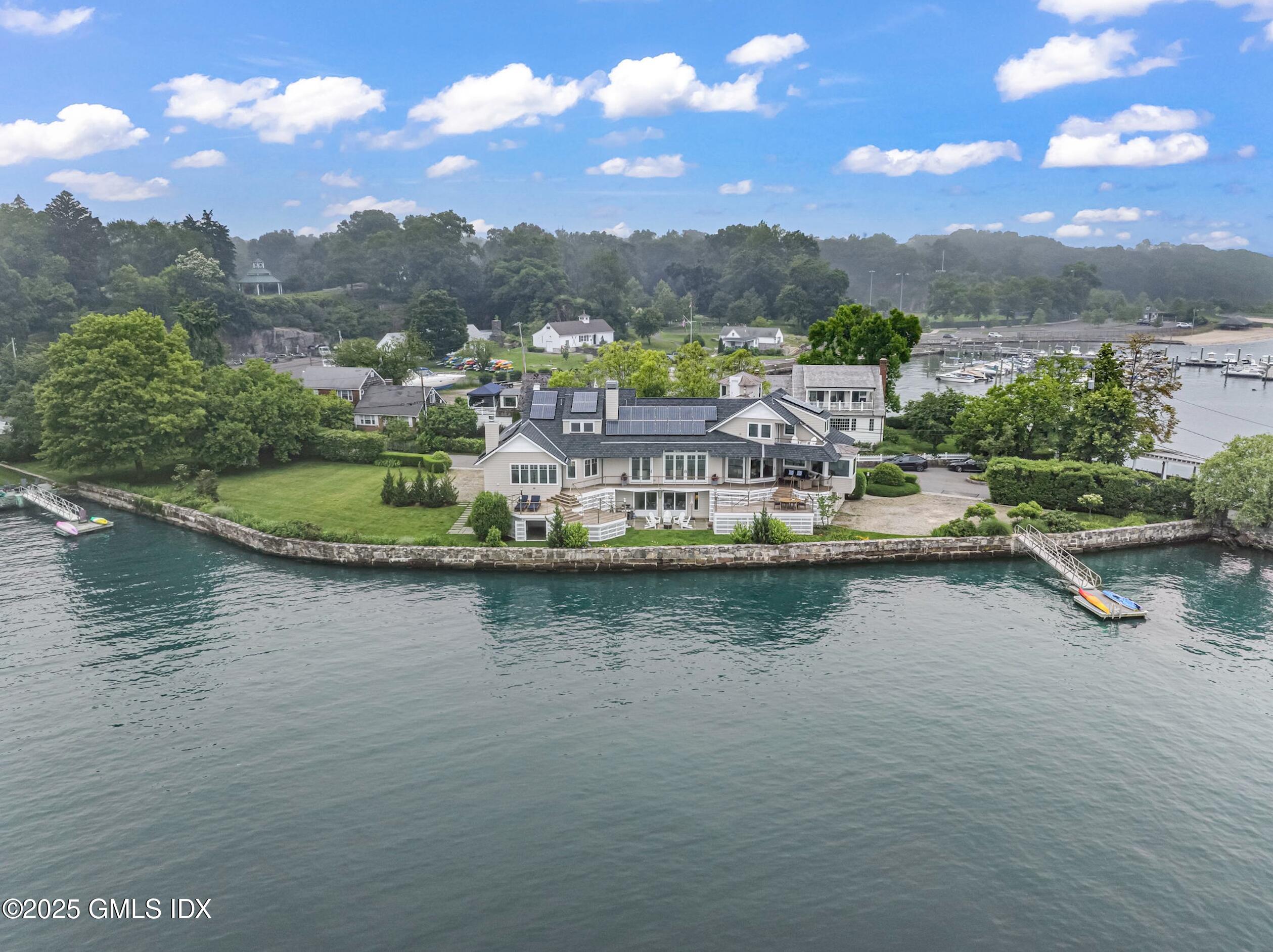 25 Game Cock Road Greenwich, CT 06830 - Photo 1 of 1 a view of a lake with a mountain