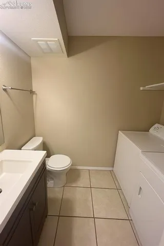 a bathroom with a sink a toilet