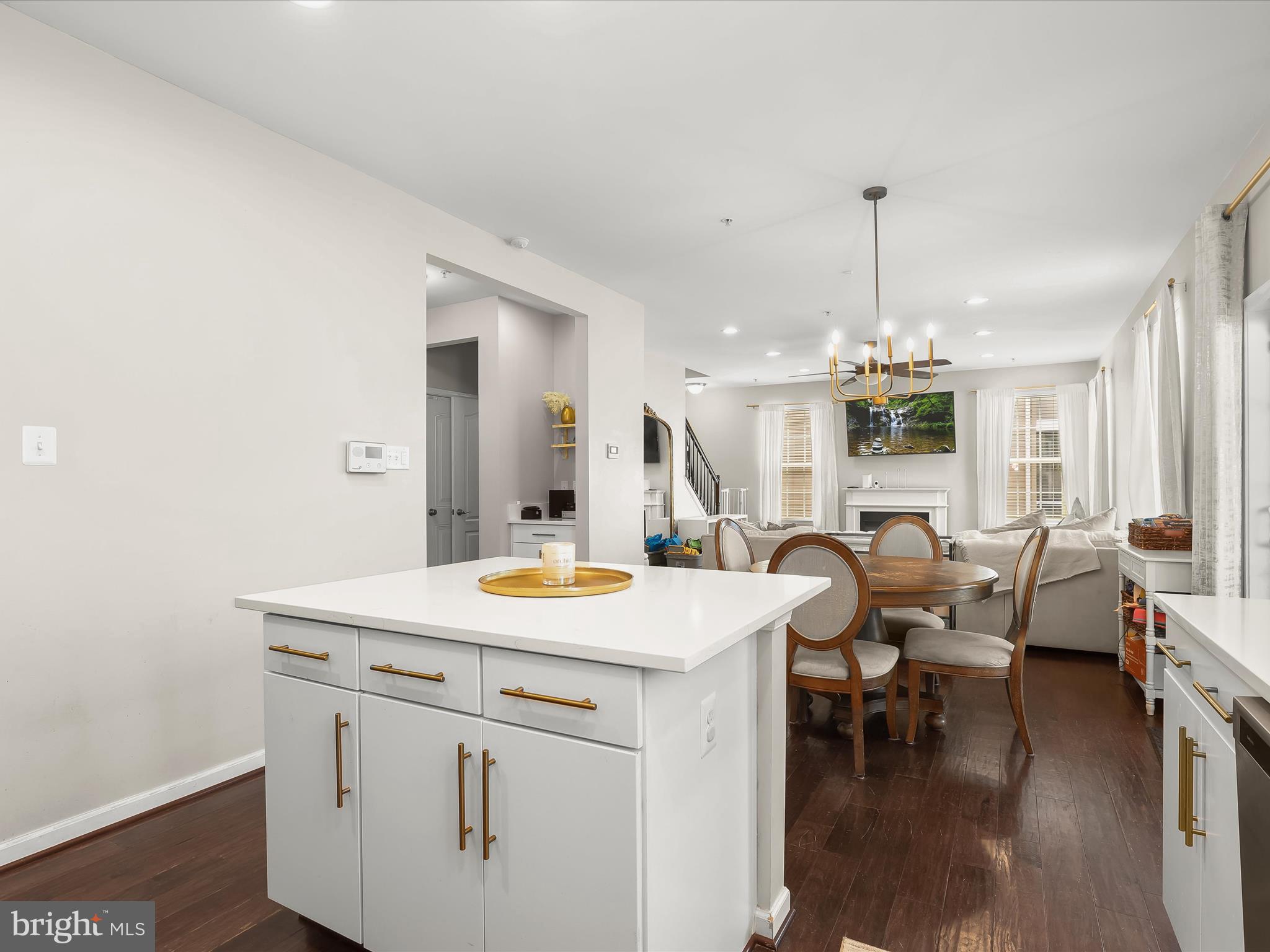 10508 Braddock Run Road Baltimore, MD 21220 - Photo 12 of 54 a view of a kitchen area with furniture and wooden floor