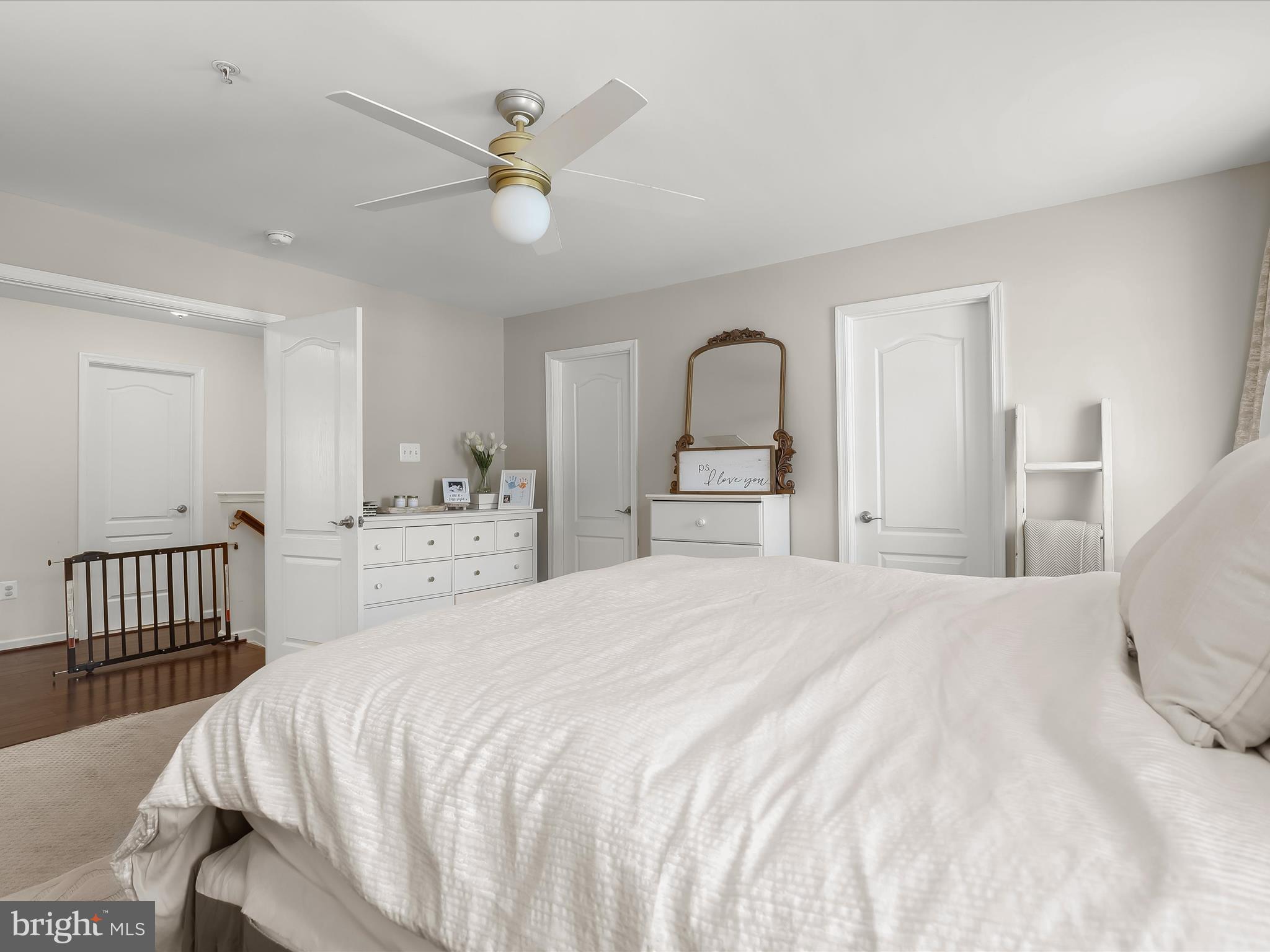 10508 Braddock Run Road Baltimore, MD 21220 - Photo 22 of 54 a bedroom with a large bed and a chandelier