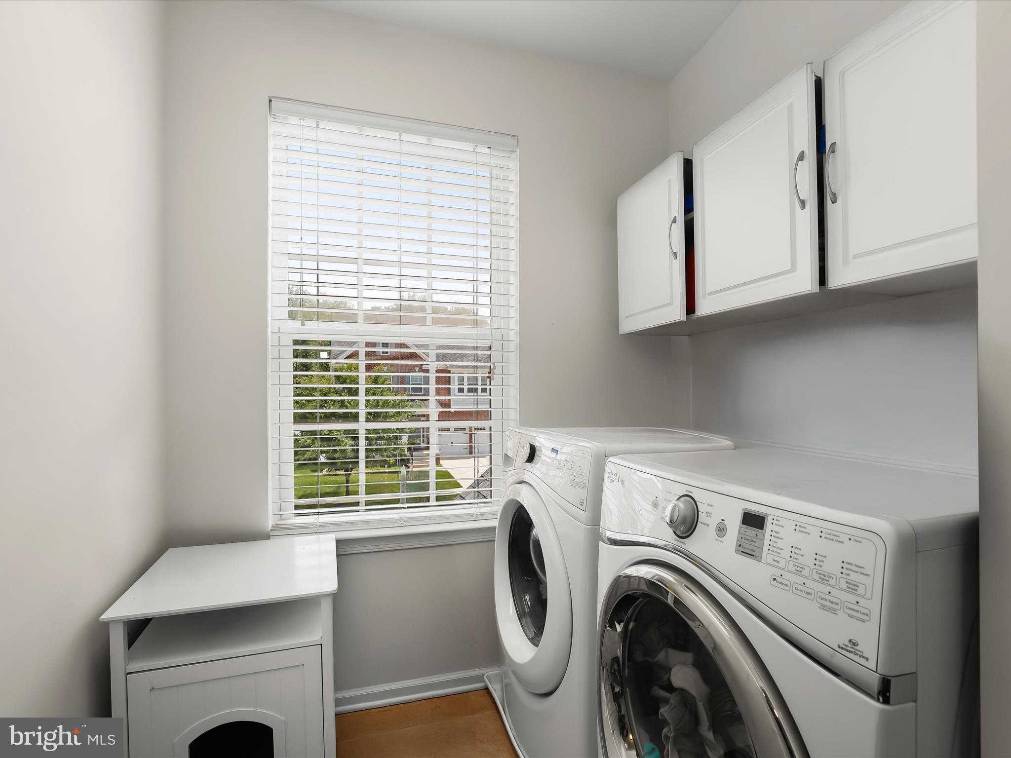 10508 Braddock Run Road Baltimore, MD 21220 - Photo 34 of 54 a view of washer and dryer with kitchen in the background