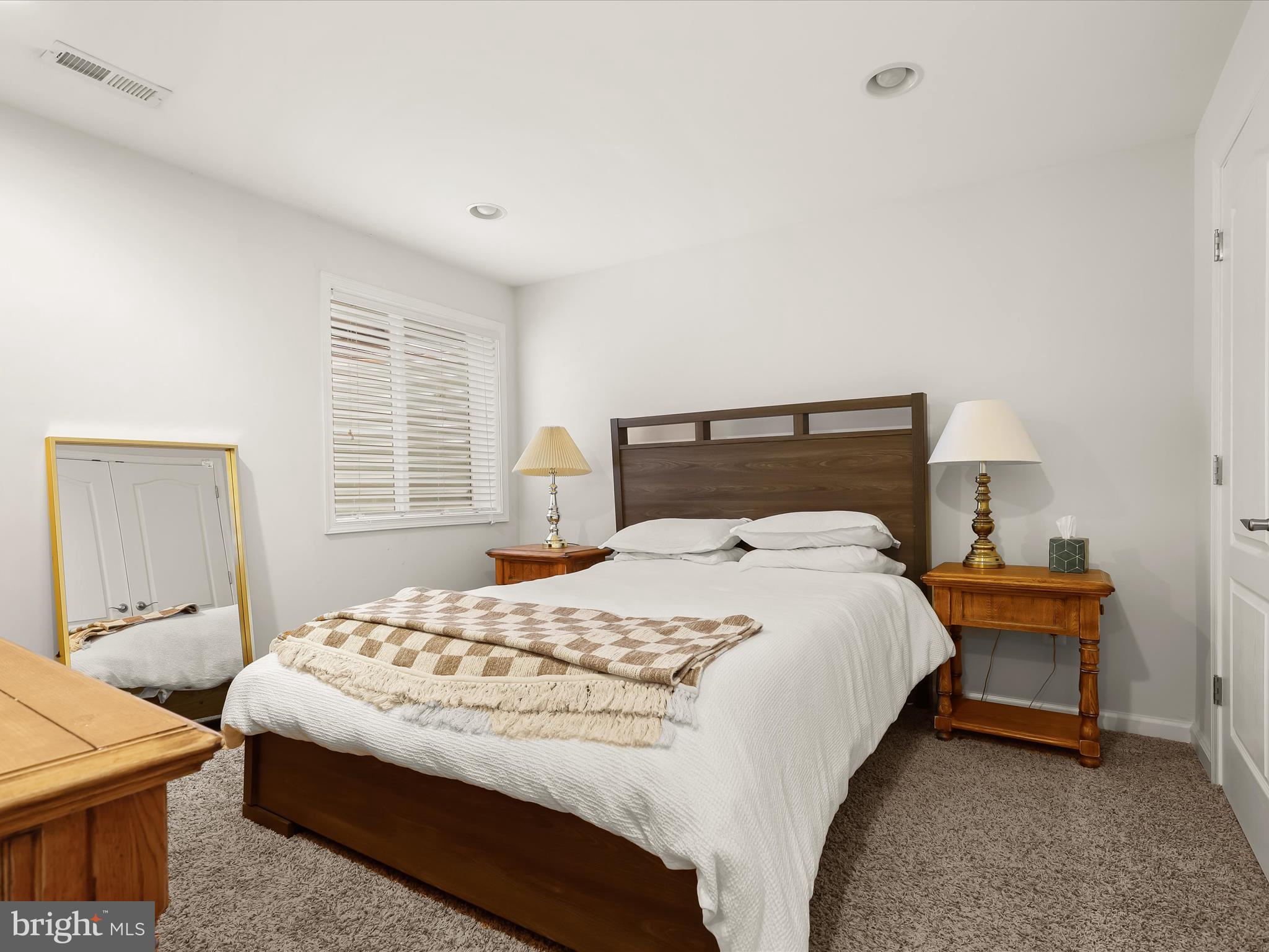 10508 Braddock Run Road Baltimore, MD 21220 - Photo 39 of 54 a bedroom with a bed and a window