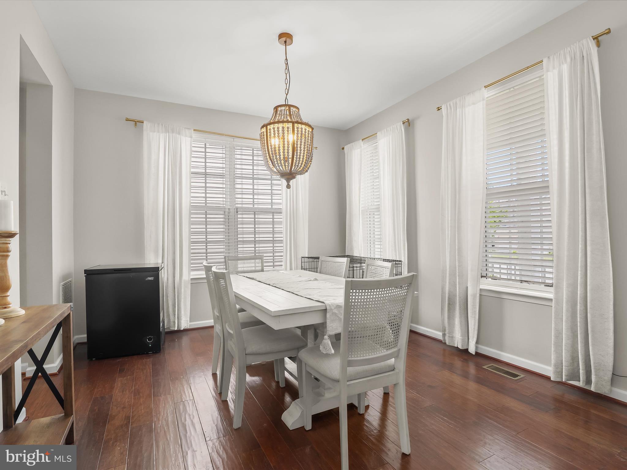 10508 Braddock Run Road Baltimore, MD 21220 - Photo 7 of 54 a view of a dining room with furniture window and wooden floor