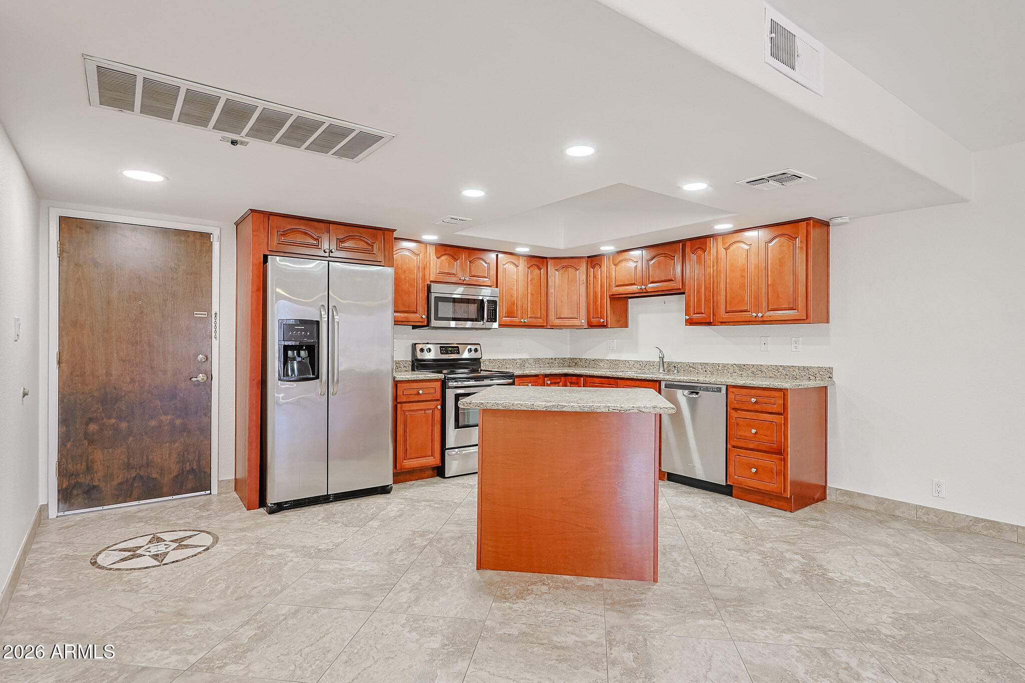 7920 East Camelback Road, Unit 111 Scottsdale, AZ 85251 - Photo 6 of 32 a kitchen with stainless steel appliances granite countertop a refrigerator and a stove