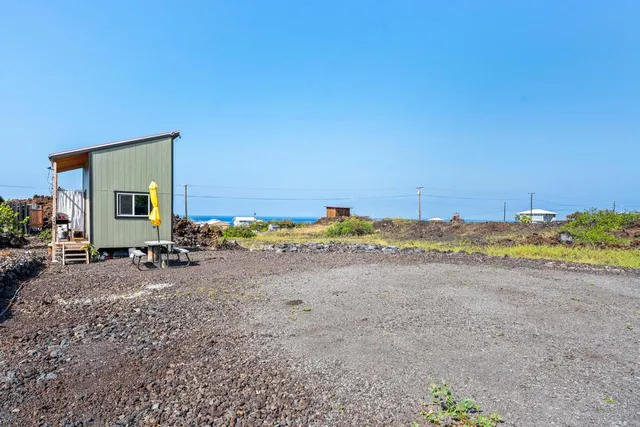 a view of a lake with a building in the background