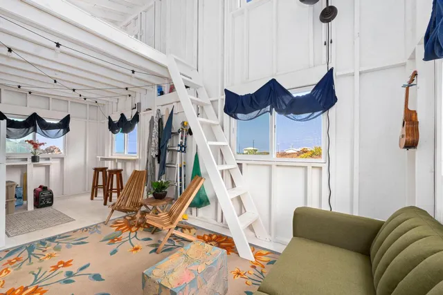 a bedroom with a bed and a night stand