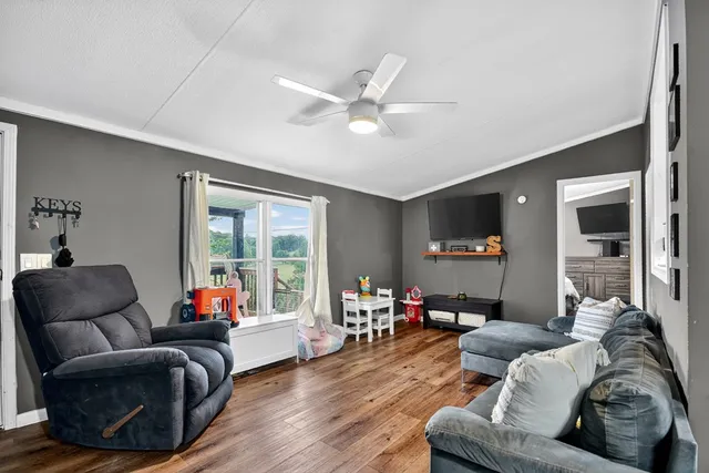 a living room with furniture and a large window