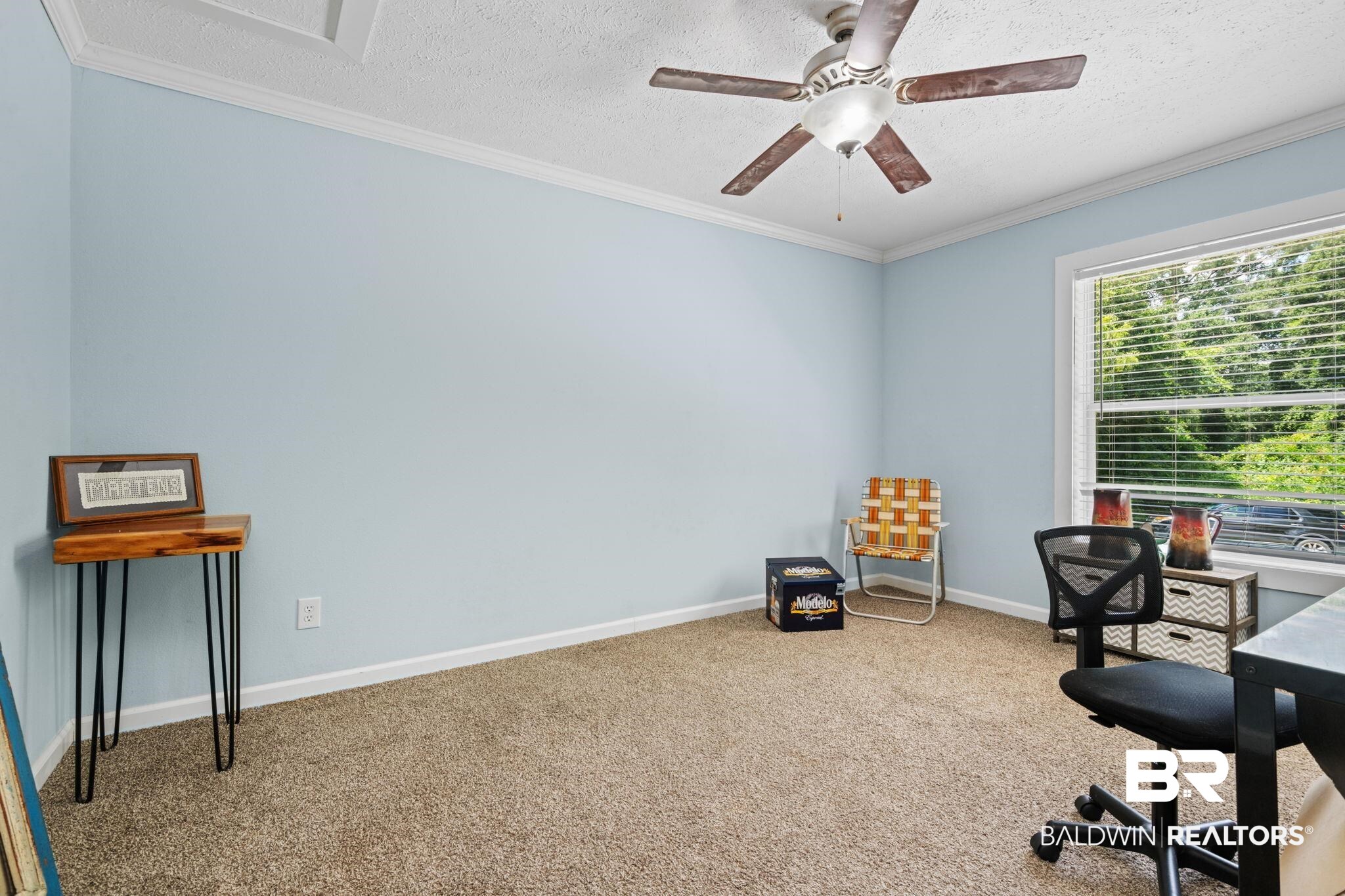10703 South Ridge Drive Semmes, AL 36575 - Photo 31 of 37 Carpeted home office with a textured ceiling, crown molding, and a ceiling fan