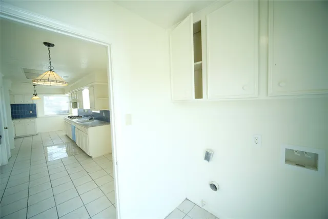 a kitchen with stainless steel appliances granite countertop a stove a sink dishwasher and a refrigerator