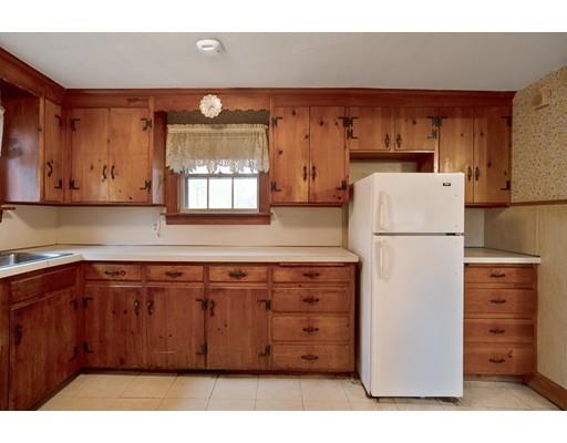 535 Maple Street Danvers, MA 01923 - Photo 11 of 23 a kitchen with cabinets appliances and a window