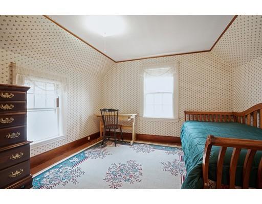 535 Maple Street Danvers, MA 01923 - Photo 17 of 23 a bedroom with furniture and a window