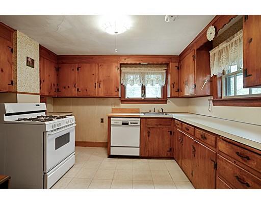 535 Maple Street Danvers, MA 01923 - Photo 10 of 23 a kitchen with a stove top oven sink and cabinets