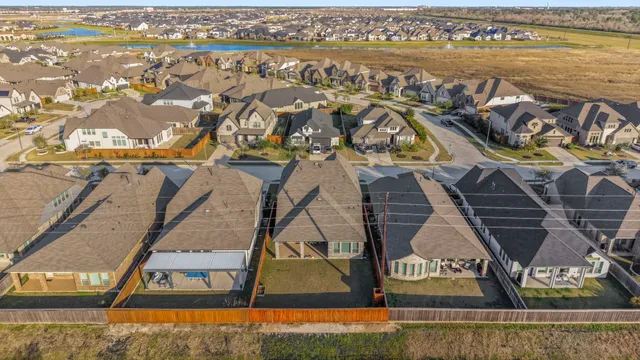 an aerial view of residential building and ocean view