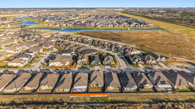 a front view of a house with a yard outdoor seating and garage