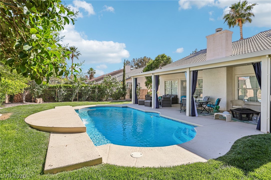 5236 Saranac Road Las Vegas, NV 89130 - Photo 43 of 52 Enjoy outdoor living with a tranquil pool and a private patio.