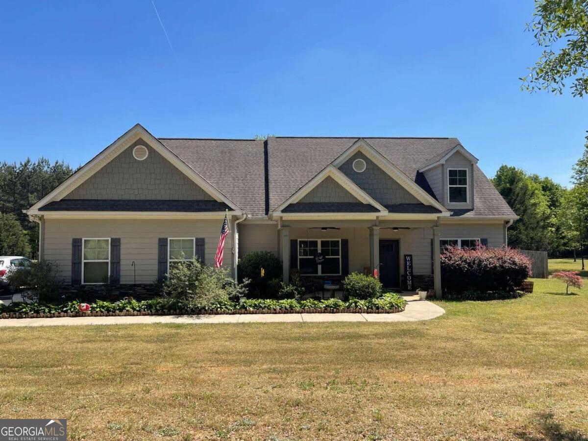 457 Old Good Hope Road Good Hope, GA 30641 - Photo 40 of 59 a front view of a house with garden