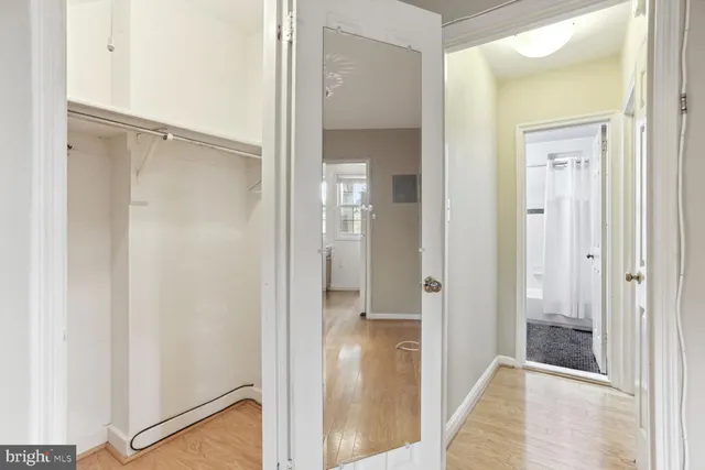 a view of a bathroom from the hallway with toilet