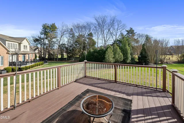 a view of a wooden deck with a garden