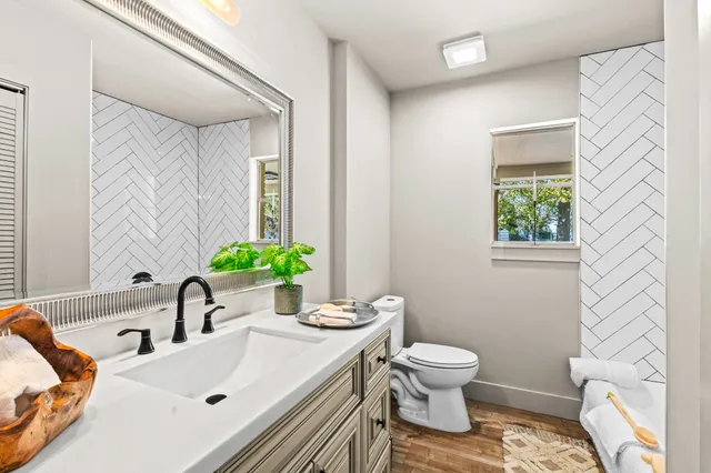 a bathroom with a sink toilet and tub