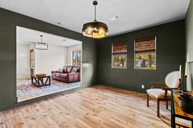 a bedroom with furniture and a chandelier