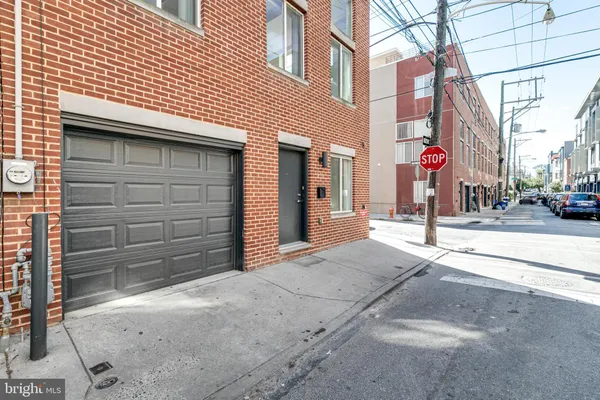 a view of a car park in front of house