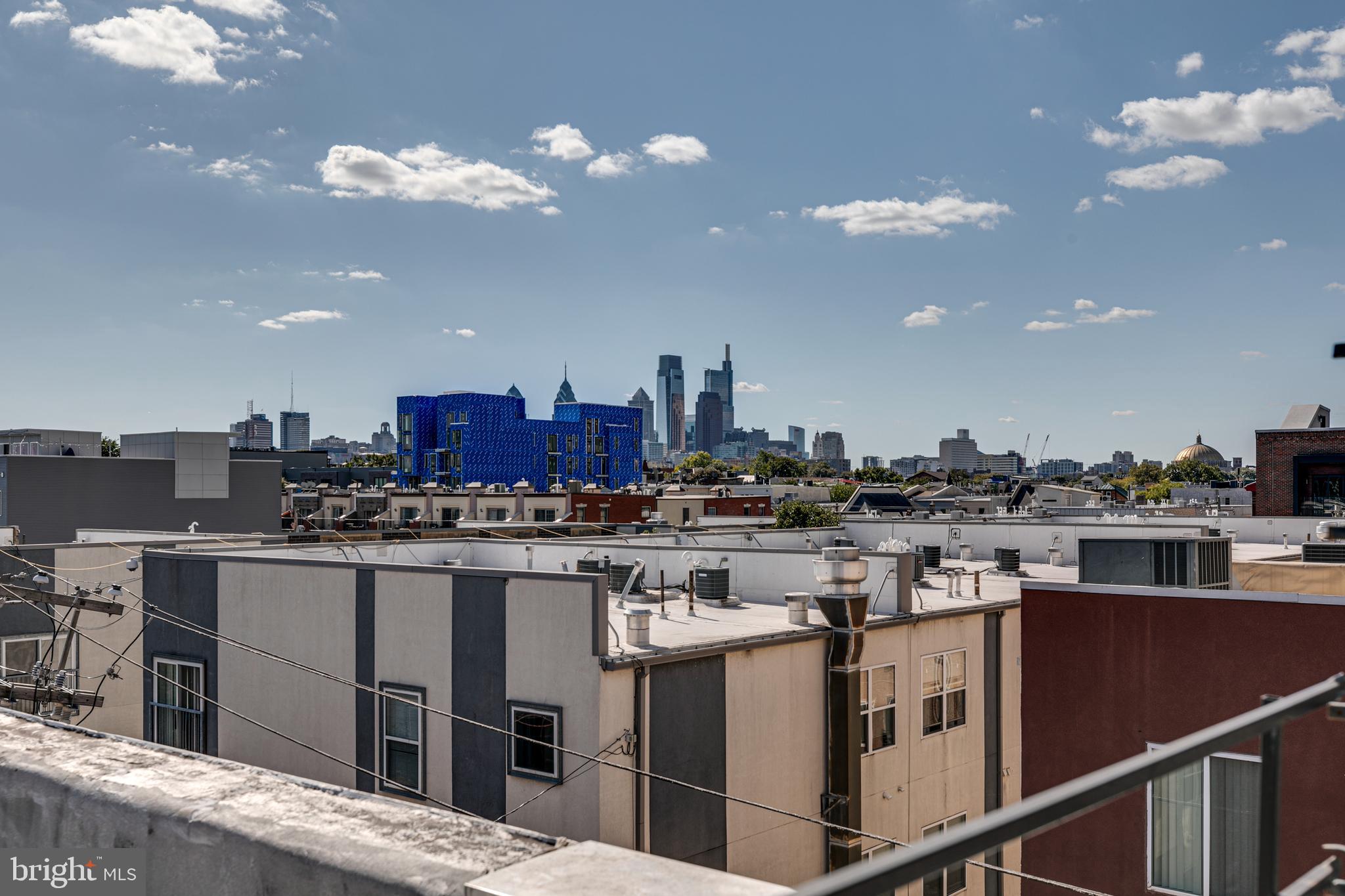 220 West George Street, Unit 224 Philadelphia, PA 19123 - Photo 56 of 56 a view of a kitchen with kitchen island a sink a stove and a refrigerator