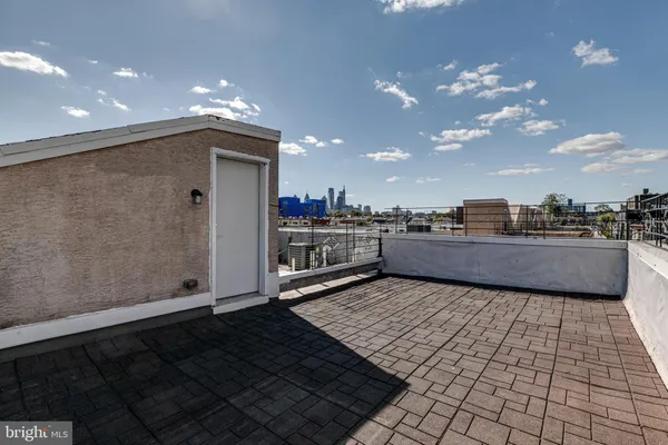 a view of kitchen and wooden floor