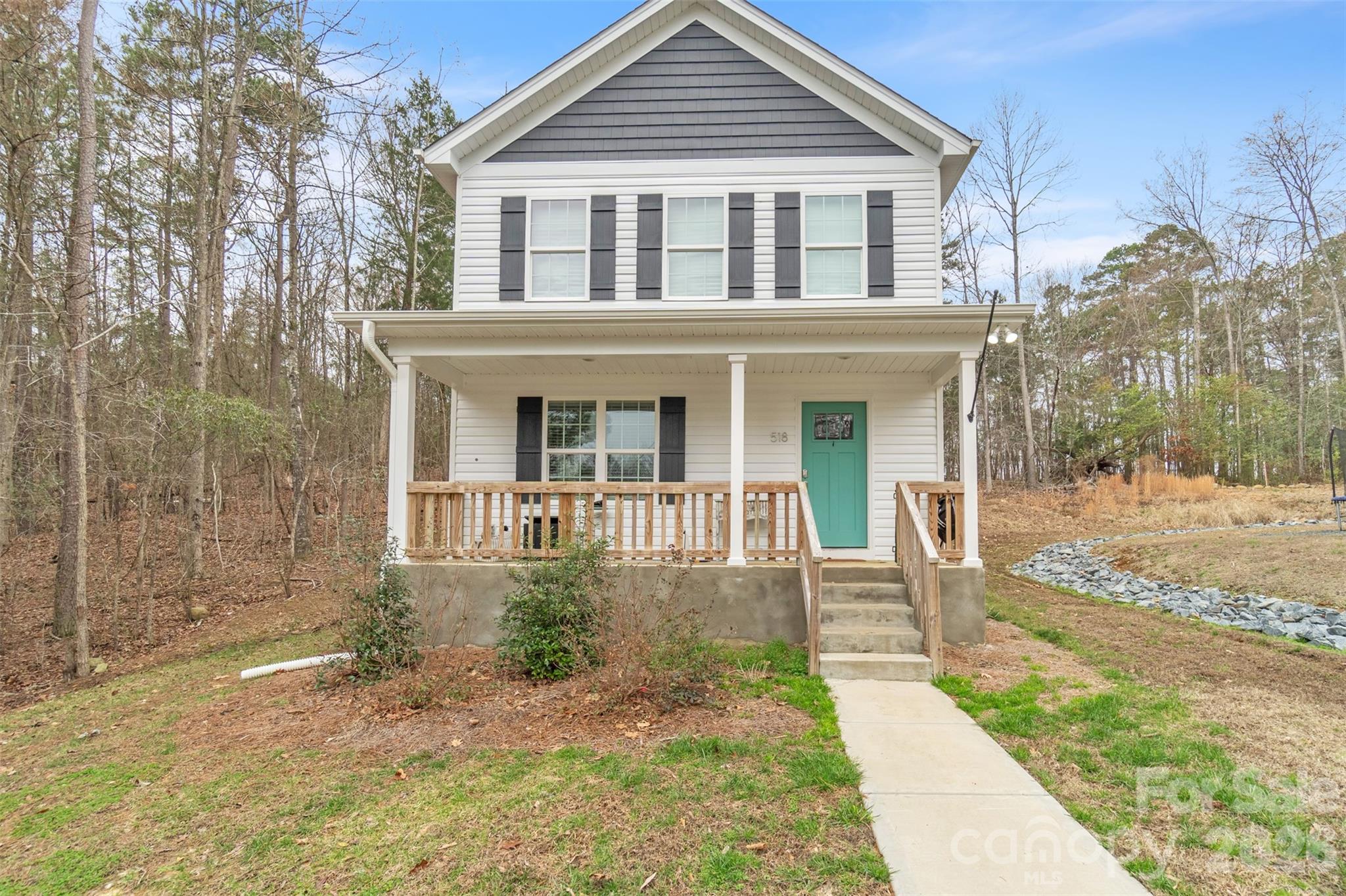 518 Lake Head Road Norwood, NC 28128 - Photo 1 of 39 a front view of a house with a yard