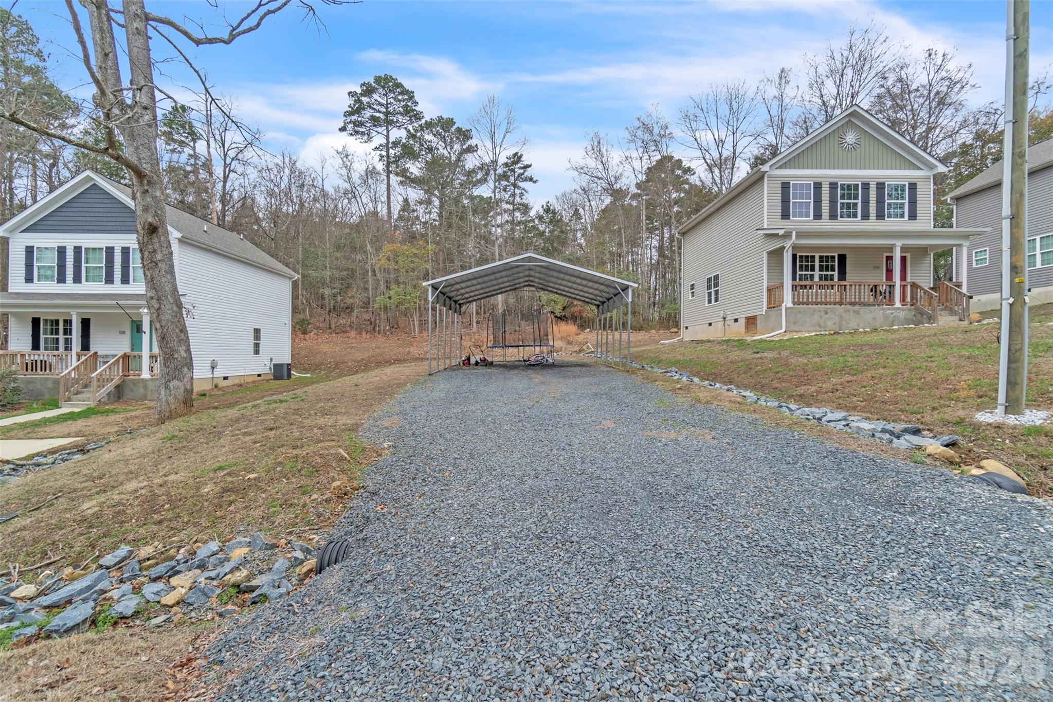 518 Lake Head Road Norwood, NC 28128 - Photo 11 of 39 a front view of a house with a yard and garage