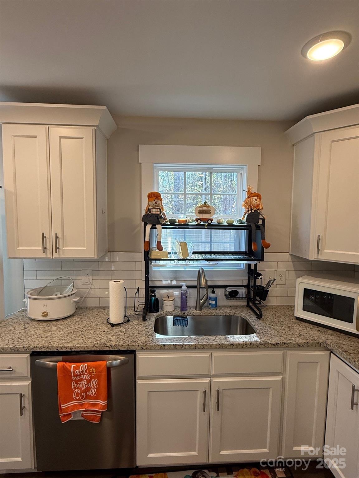 518 Lake Head Road Norwood, NC 28128 - Photo 12 of 20 a kitchen with granite countertop a stove a sink and a granite counter tops