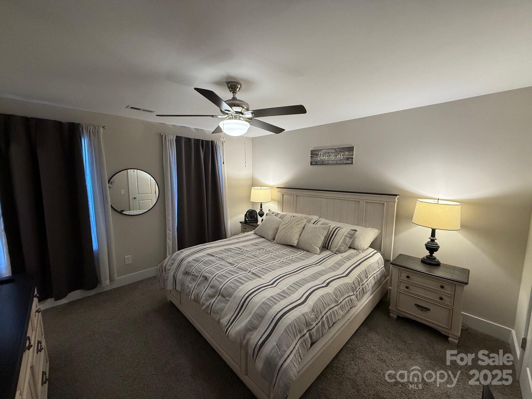 518 Lake Head Road Norwood, NC 28128 - Photo 13 of 20 a bedroom with a bed and a window