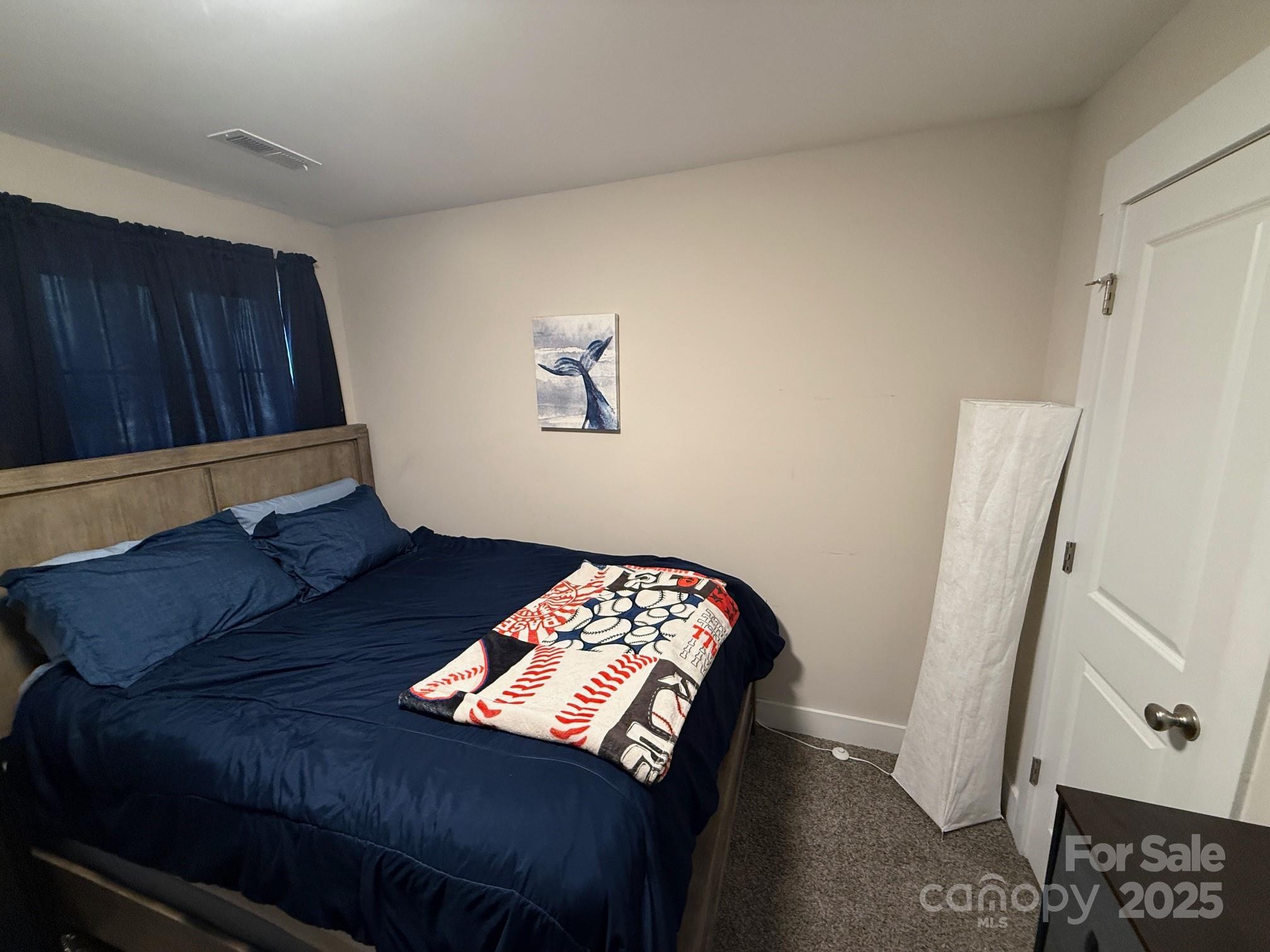 518 Lake Head Road Norwood, NC 28128 - Photo 20 of 20 a living room with furniture and a baby crib