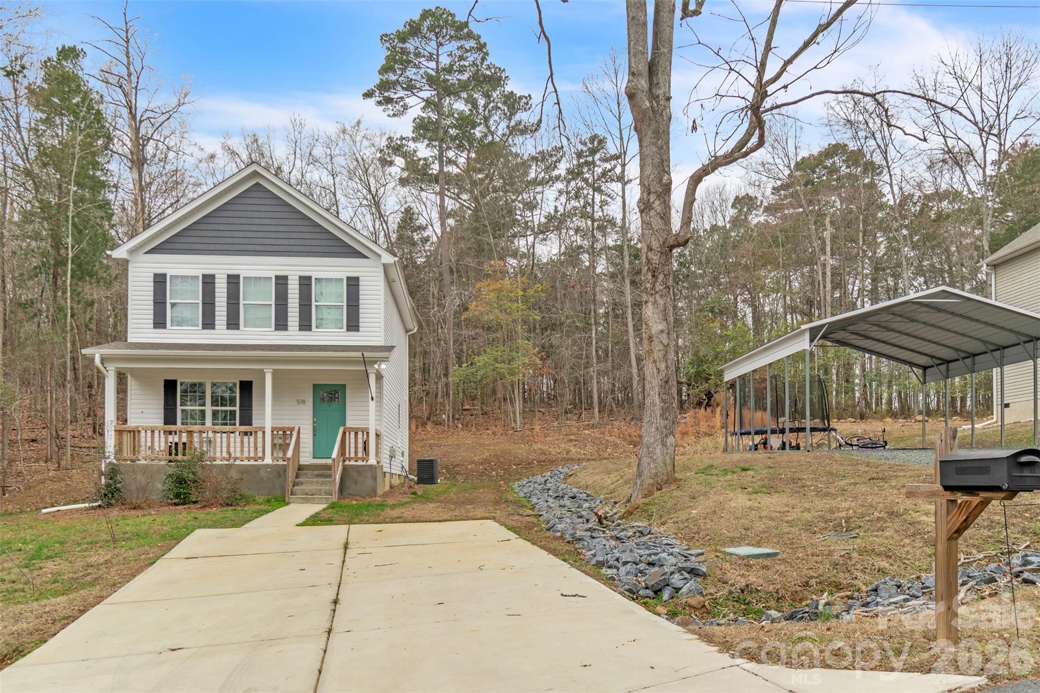 518 Lake Head Road Norwood, NC 28128 - Photo 2 of 39 front view of a house with a yard