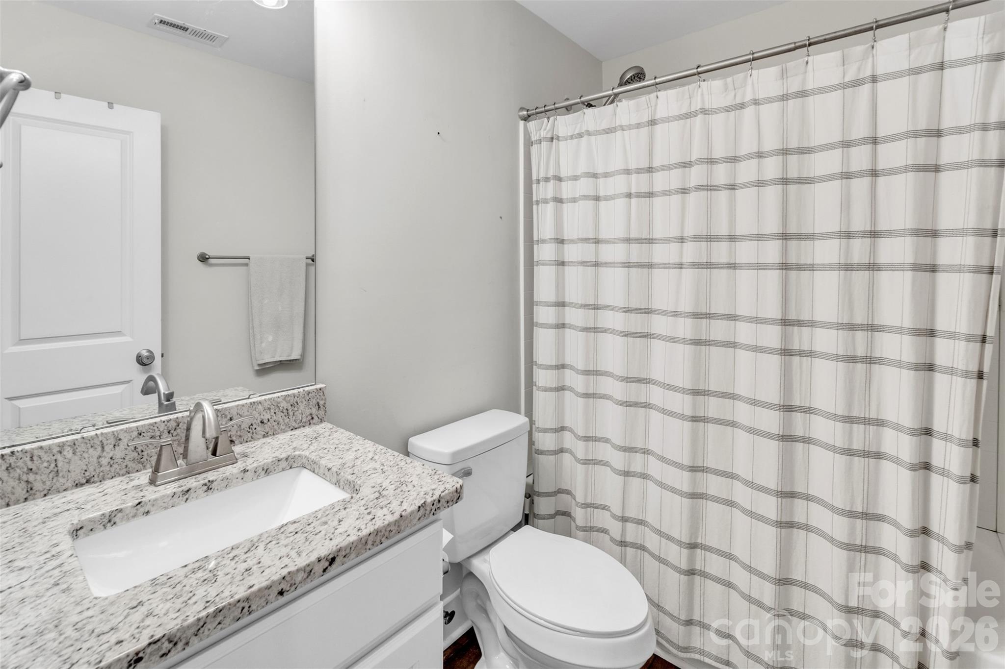 518 Lake Head Road Norwood, NC 28128 - Photo 30 of 39 a bathroom with a granite countertop sink toilet and shower