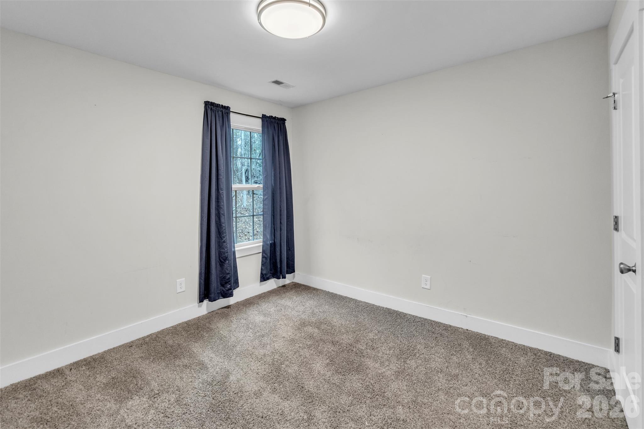 518 Lake Head Road Norwood, NC 28128 - Photo 35 of 39 a view of an empty room with window