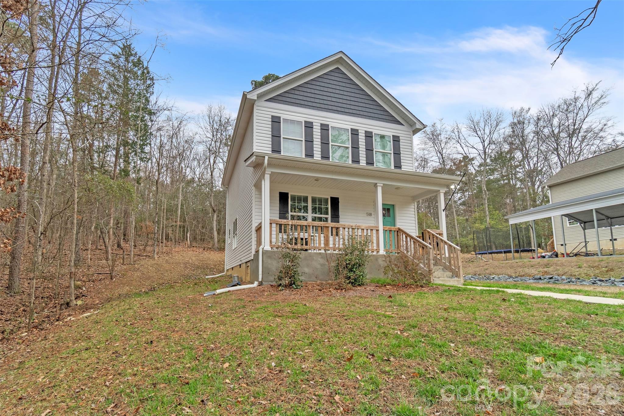 518 Lake Head Road Norwood, NC 28128 - Photo 4 of 39 a front view of a house with a yard