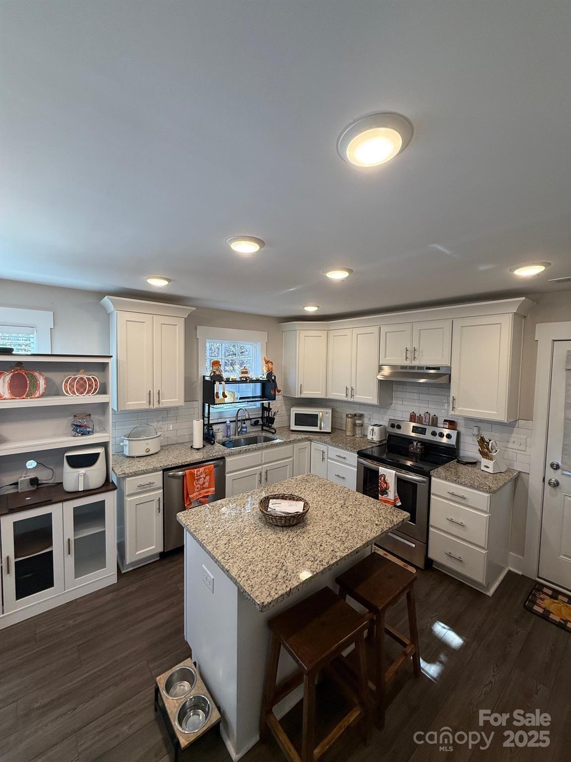 518 Lake Head Road Norwood, NC 28128 - Photo 6 of 20 a kitchen with a stove a sink and a refrigerator