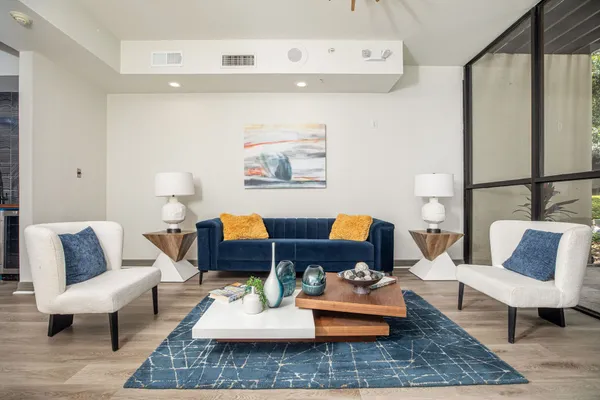 a living room with furniture and a rug