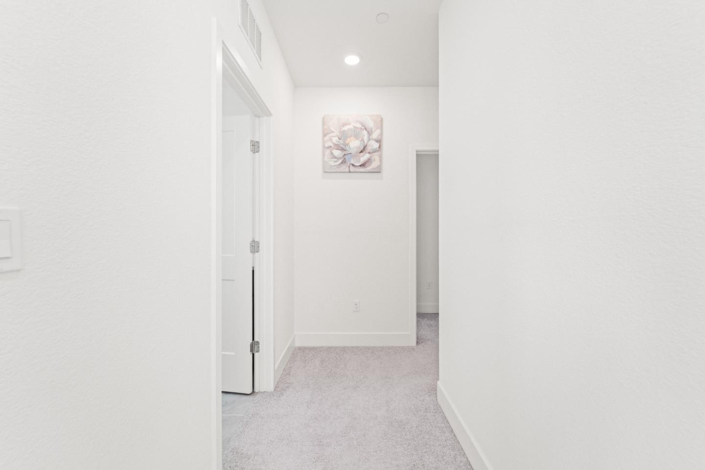 384 Ramos Ranch Road Oakley, CA 94561 - Photo 27 of 39 a view of a hallway with paintings on the wall