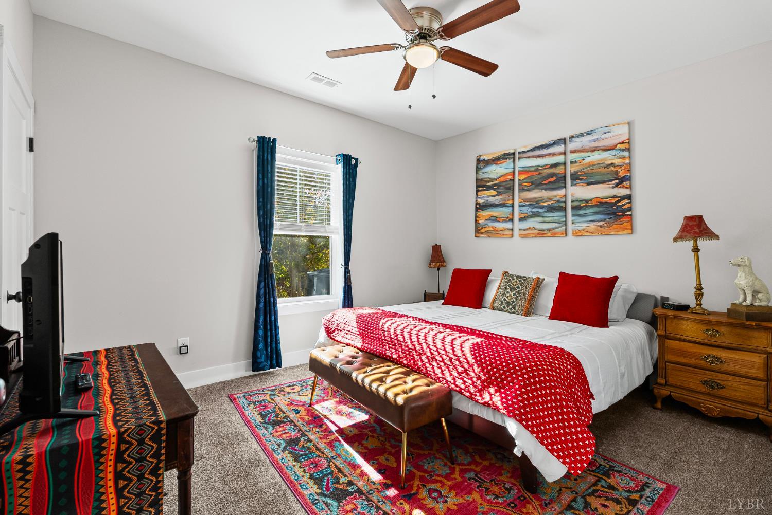 1301 Stoney Ridge Boulevard, Unit 105 Forest, VA 24551 - Photo 14 of 31 a bedroom with a bed and a chandelier