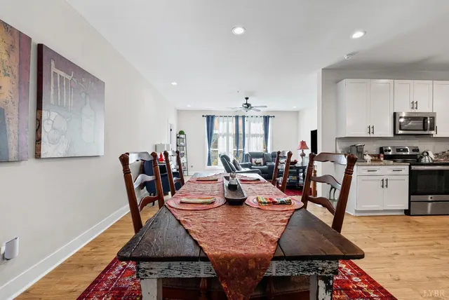 a dining hall with dining table and chairs