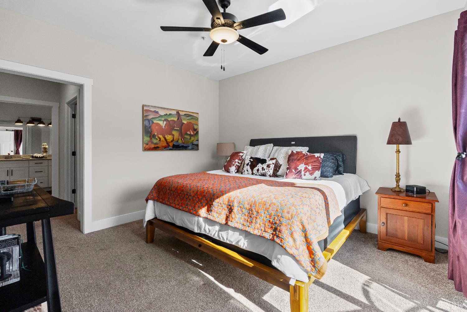 1301 Stoney Ridge Boulevard, Unit 105 Forest, VA 24551 - Photo 20 of 31 a bedroom with a bed and a chandelier