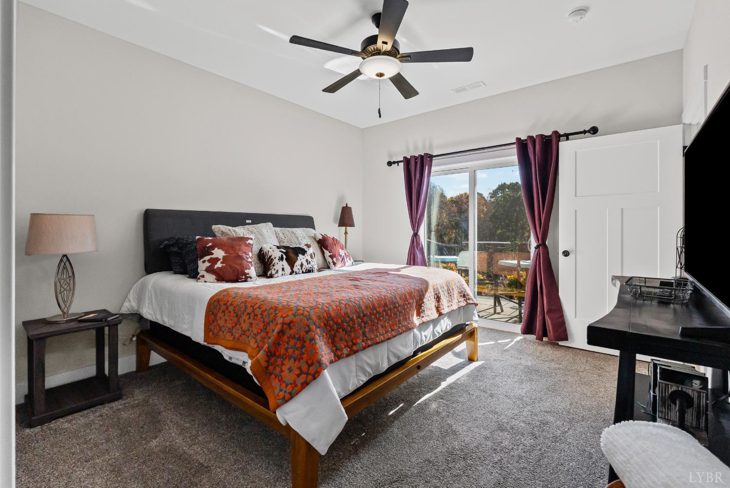 1301 Stoney Ridge Boulevard, Unit 105 Forest, VA 24551 - Photo 21 of 31 a bed sitting in a bedroom next to a window