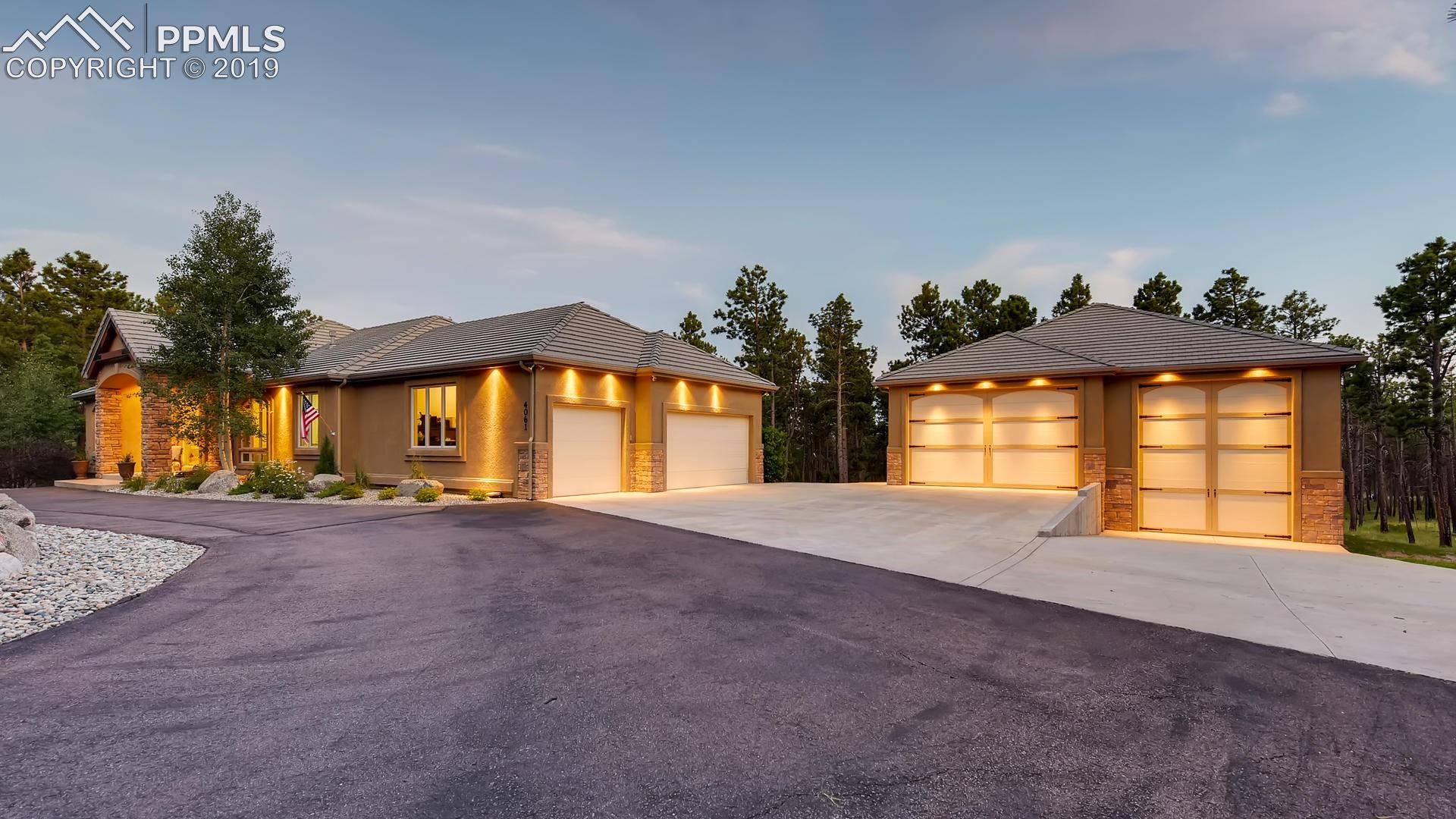 4061 High Forest Road Colorado Springs, CO 80908 - Photo 3 of 40 5,756 sq ft, 5 bedroom, 4 bath with oversized 3 car garage...and state-of-the-art detached garage.