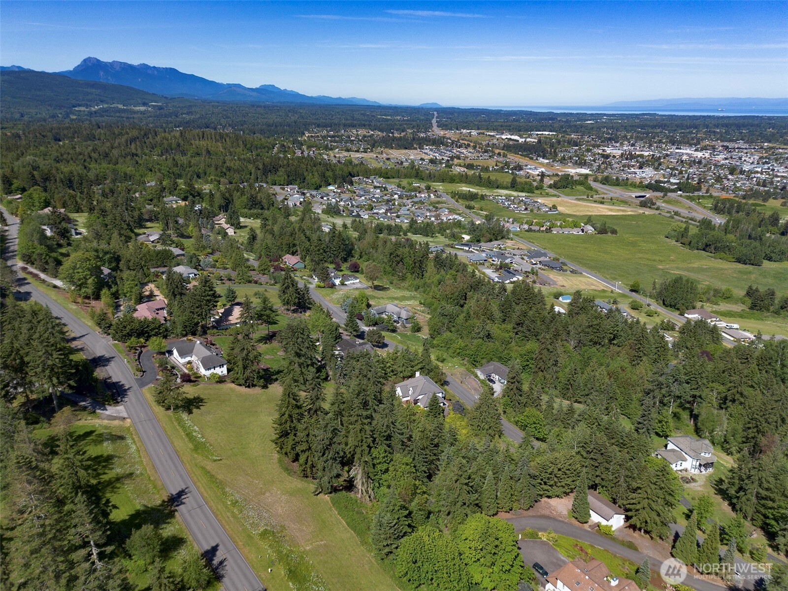 1 Owls Nest Road Sequim, WA 98382 - Photo 30 of 31 a view of a city with mountains in the background