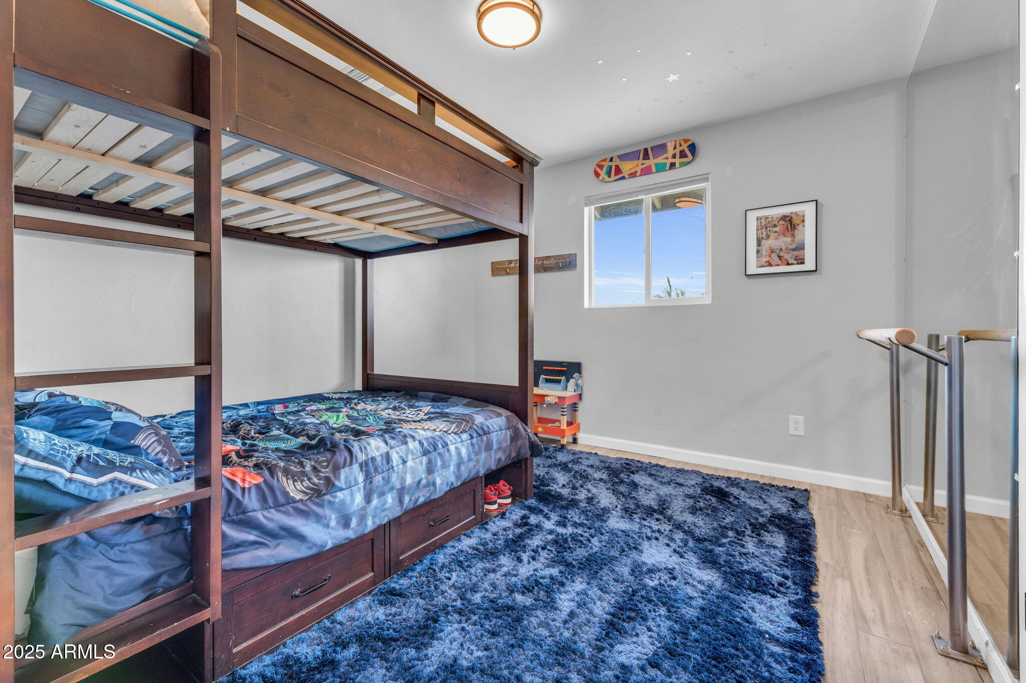 4928 East Palm Lane Phoenix, AZ 85008 - Photo 11 of 17 a bedroom with a bed and a walk in closet